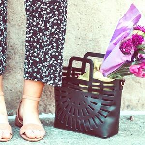 Black purse with cut out details